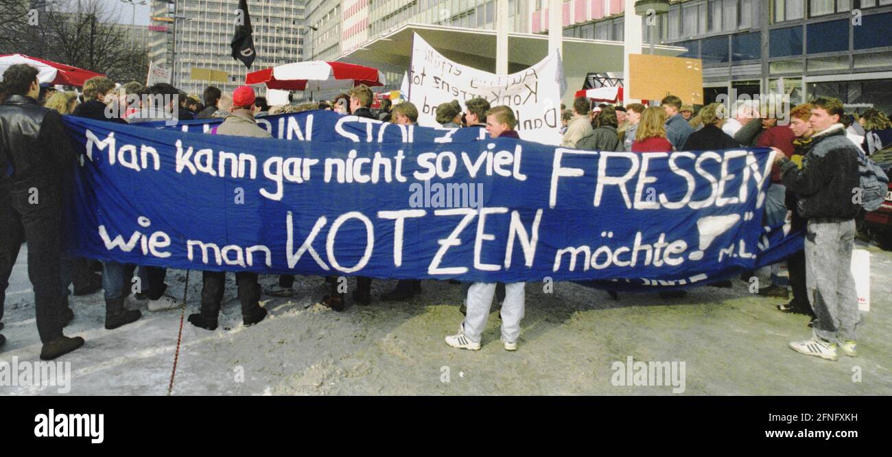 Berlin-Mitte / Alexanderplatz / 1991 Demonstration against the Treuhand-Anstalt at Alexanderplatz 6. Employees of the GDR airline Interflug protest against the end of operations. The sign reads -You can't eat as much as you want to puke- // Demo / DDR / Liquidation / Unification / [automated translation] Stock Photo