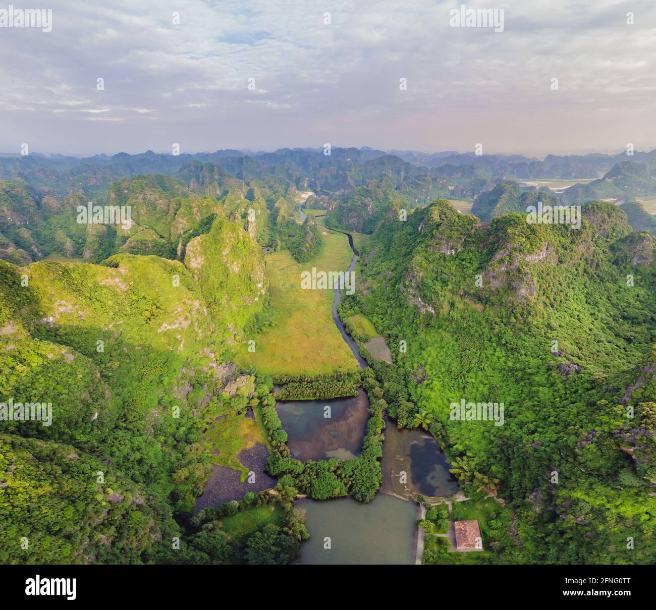 the majestic scenery on Ngo Dong river in Tam Coc Bich Dong view from drone in Ninh Binh province of Viet Nam Stock Photo