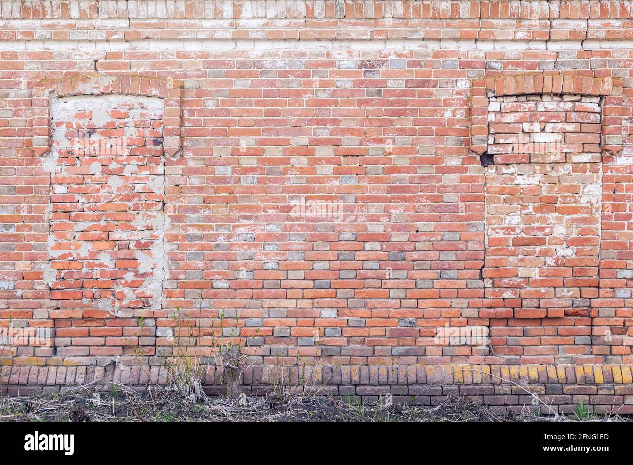 wall of old brick with laid windows, vintage background Stock Photo - Alamy