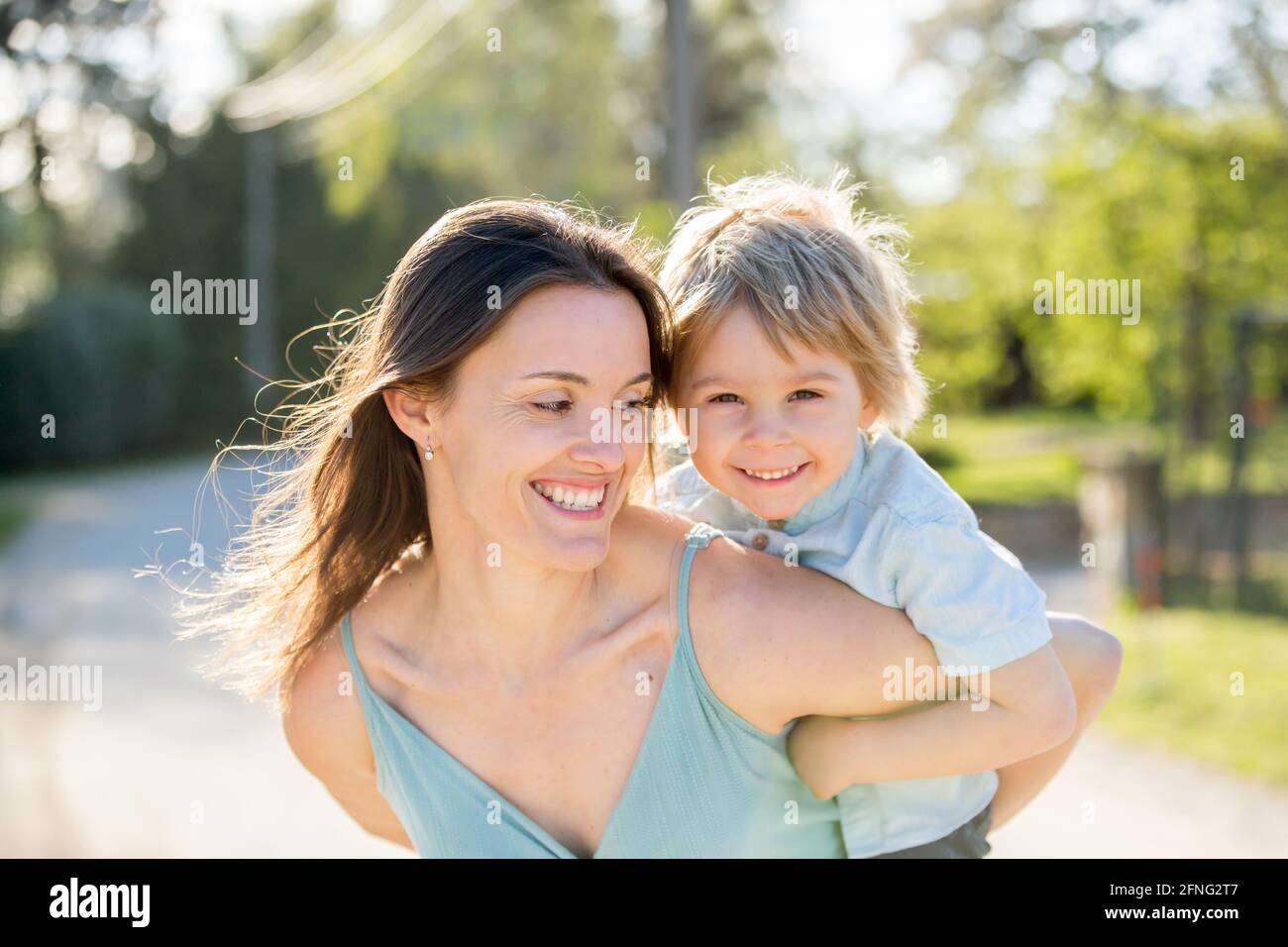 Beautiful family with kids, mom, dad, three boys and a dog, playing in ...