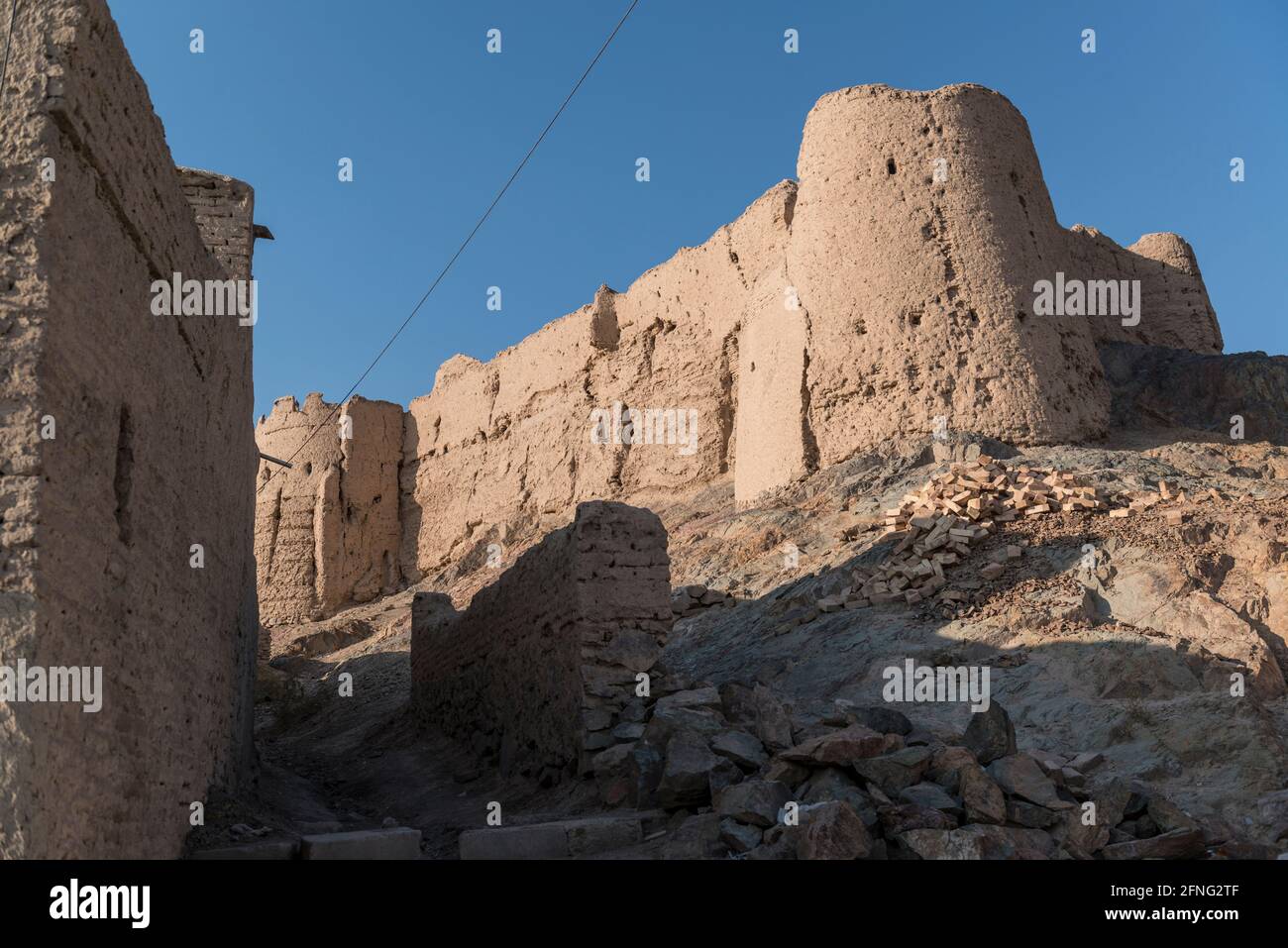 The ruins of the citadel of Mohammadieh on top of a hill, near the town Stock Photo