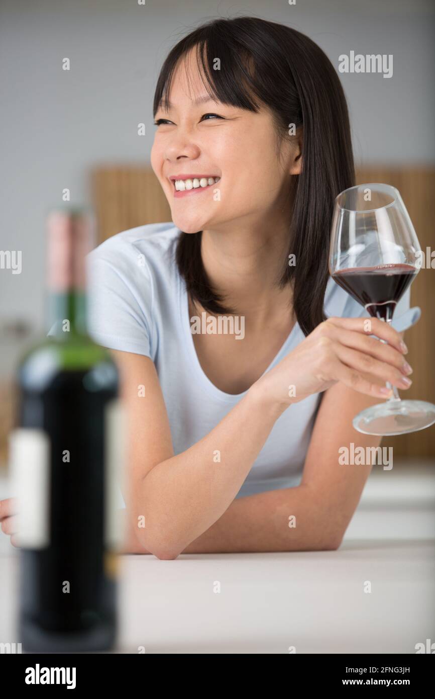 young female customer drinking red wine Stock Photo