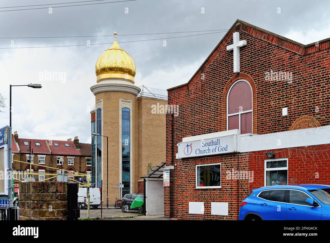The Golden dome of the Sikh temple Gurdwara Guru Nanak Darber  in Kings Road Southall London Borough of Ealing England UK Stock Photo