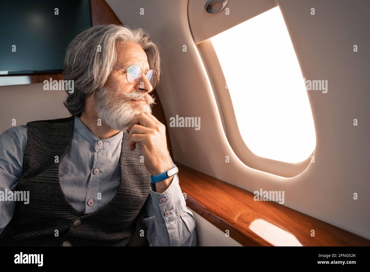 Middle aged man looking smartwatch hi-res stock photography and images ...