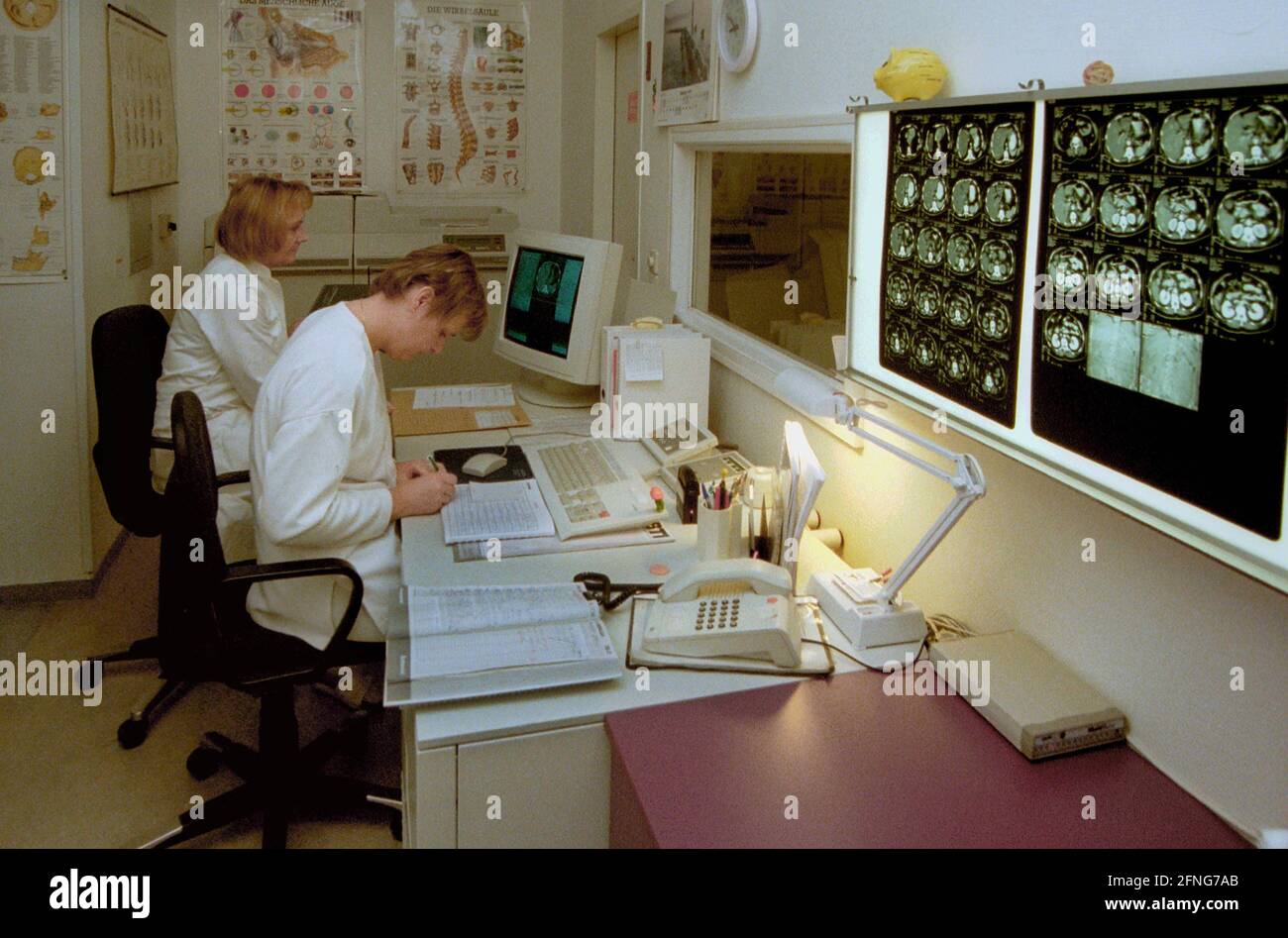 Berlin / Health / Hospital / 1997 Hospital Prenzlauer Berg, Internal Department.  Computer tomography / Roentgen. Physician and nurse evaluate Roentgen images // Physician / Cancer / Diagnosis / [automated translation] Stock Photo