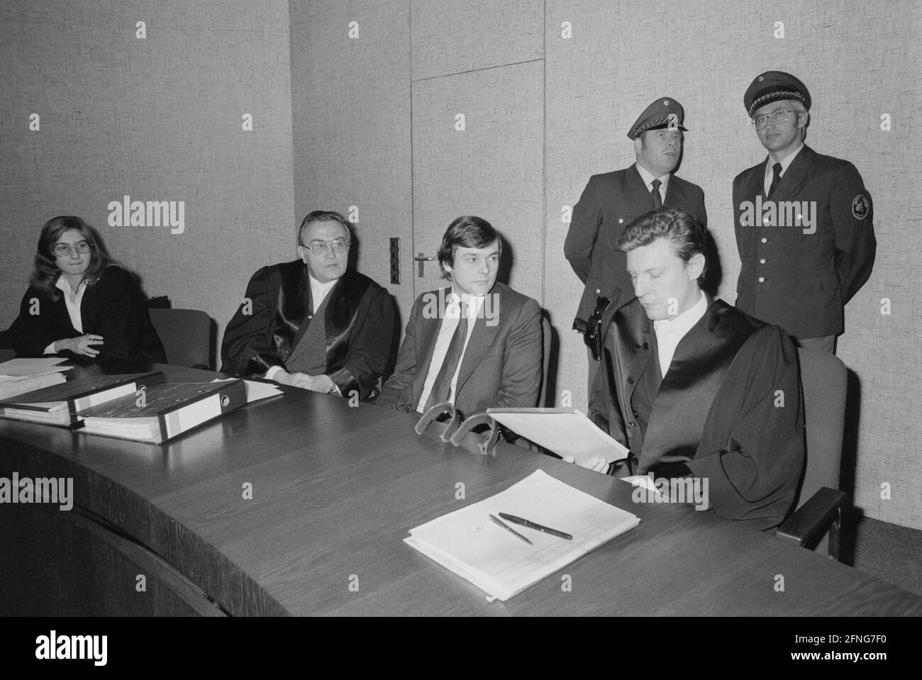 Richard Oetker with his lawyers in the courtroom in Munich at the trial