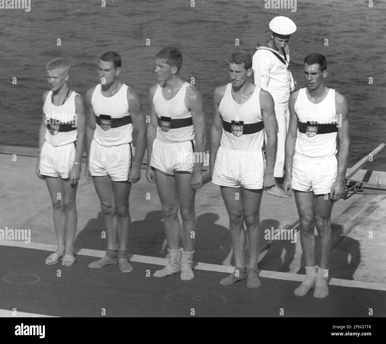 1960 Summer Olympics in Rome. Rowing: The coxed four of the rowing club Germania Düsseldorf won the gold medal. At the award ceremony from left: cox Michael Obst, stroke Jürgen Litz, Klaus Riekmann, Horst Effertz and Gerd Cintl. [automated translation] Stock Photo