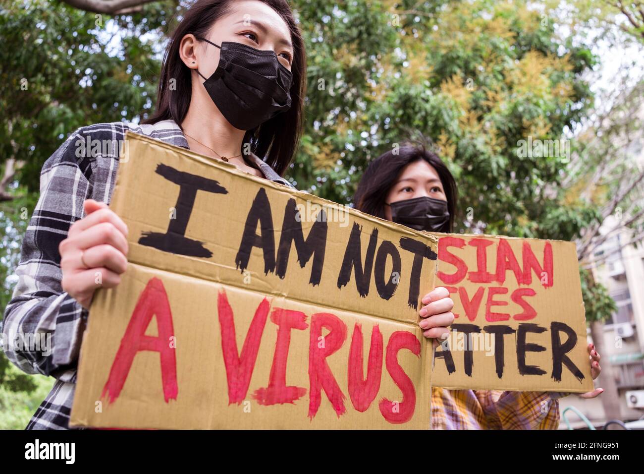 Anti Racism Mask Ethnic females in masks holding posters protesting against racism in ...