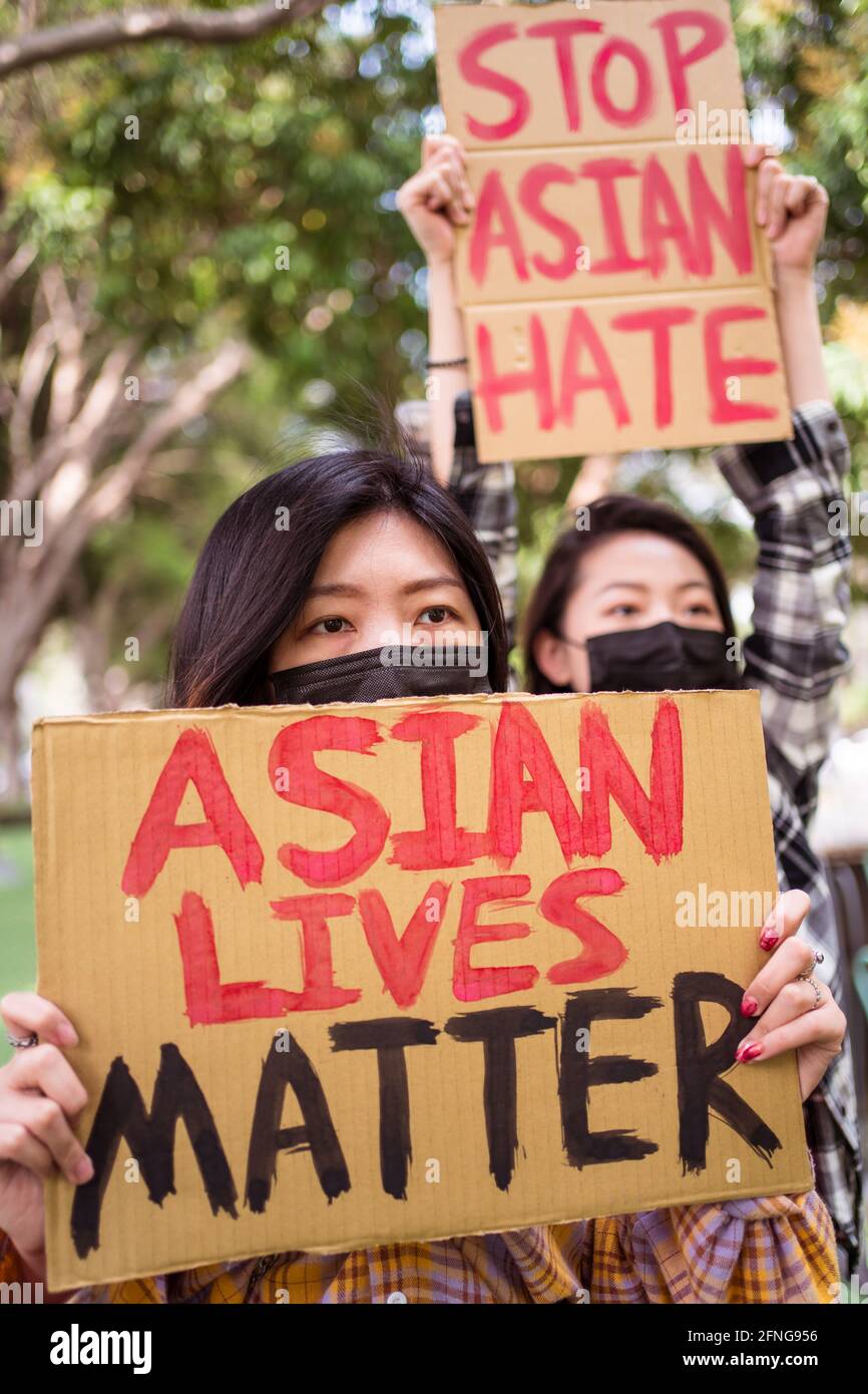 Anti Racism Mask Ethnic females in masks holding posters protesting against racism in ...