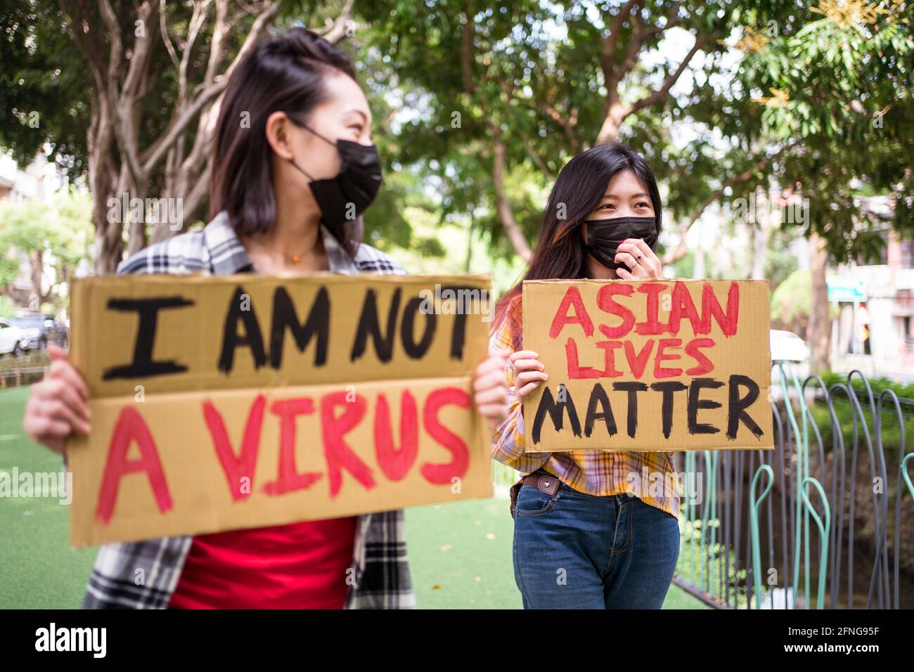 Anti Racism Mask Ethnic females in masks holding posters protesting against racism in ...