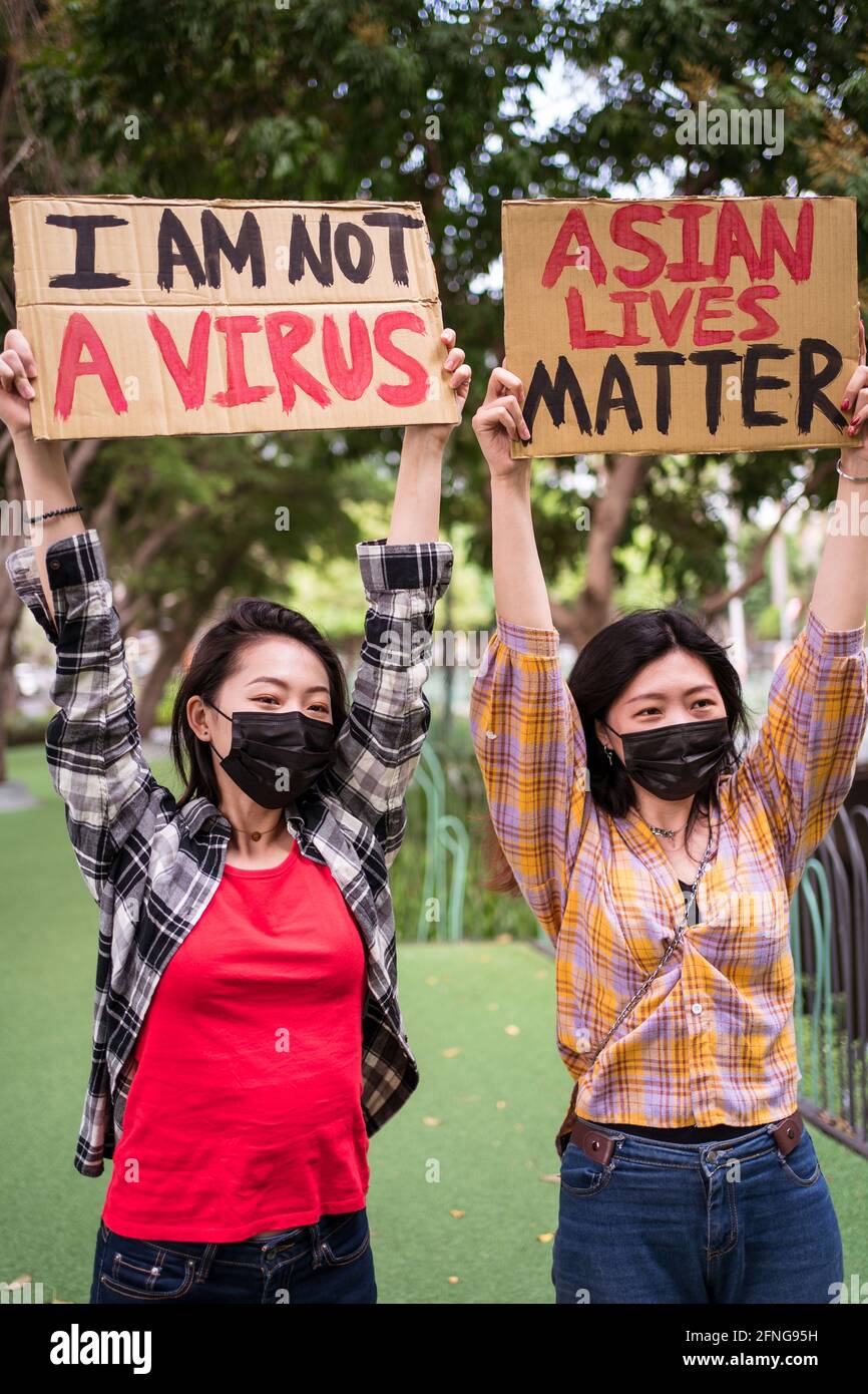Anti Racism Mask Ethnic females in masks holding posters protesting against racism in ...