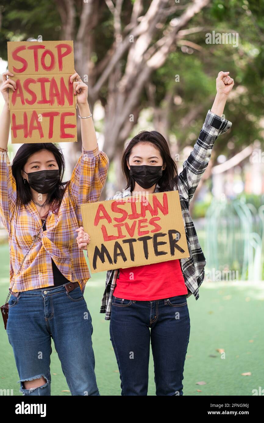Anti Racism Mask Ethnic females in masks holding posters protesting against racism in ...