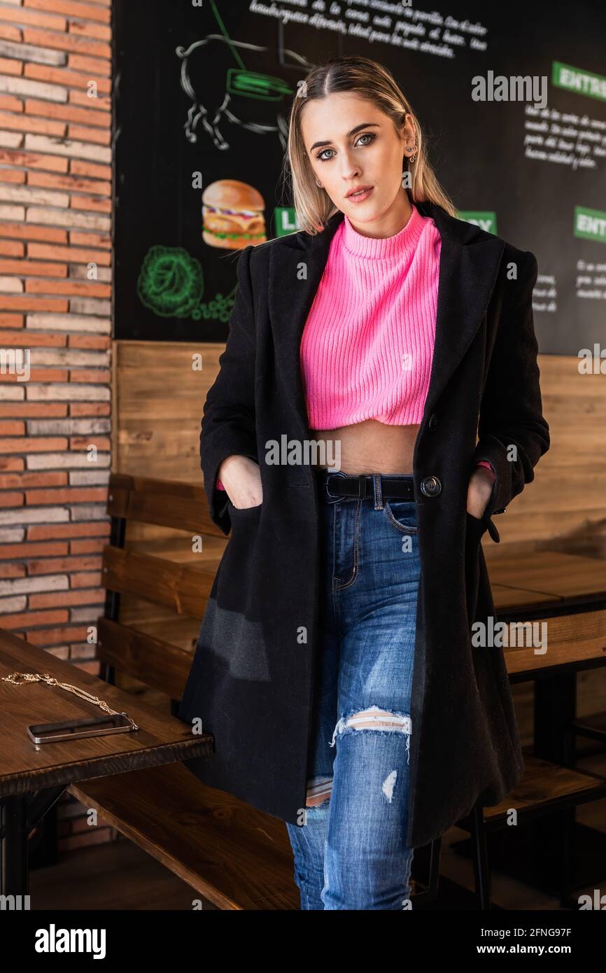 pink sweater and black jeans