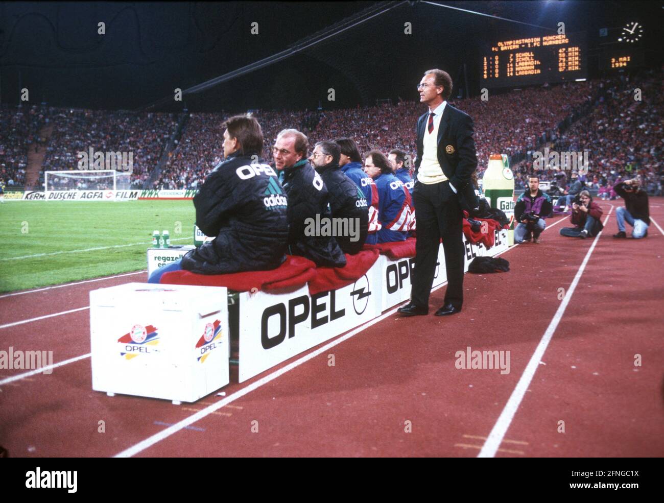 Bayern Munich - 1. FC Nuremberg 5:0 /03.05.1994/ Repeat match Coach Franz Beckenbauer (FC Bayern Munich) is standing next to the bench, behind the scoreboard with the final result. on the bench from left: Klaus Augenthaler, Uli Hoeness und Gerd Müller [automated translation] Stock Photo