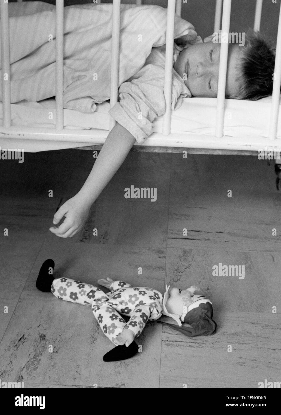 Boy sleeping in crib, 60s [automated translation] Stock Photo