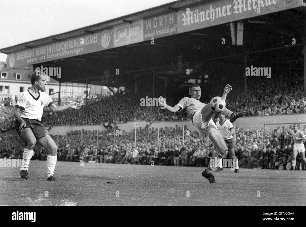 Football Bundesliga 1965/66. 1860 Munich - FC Bayern Munich 1:0/14/08/1965.  Timo Konietzka (1860/re.) action. Left: Jakob Drescher (FCB). For  journalistic use only! Only for editorial use! [automated translation]  Stock Photo - Alamy