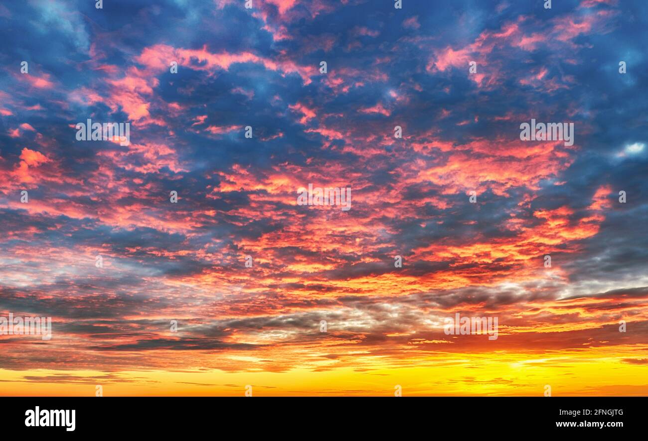 Only sky at sunset, abstract view with red and orange clouds Stock Photo