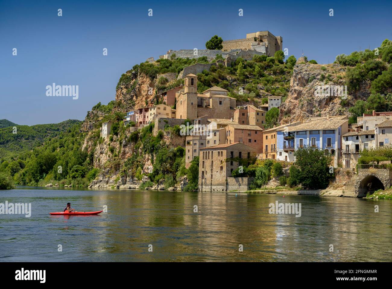 Miravet village and castle seen from the jetty on the Ebro river (Ribera d'Ebre, Tarragona, Catalonia, Spain) Stock Photo
