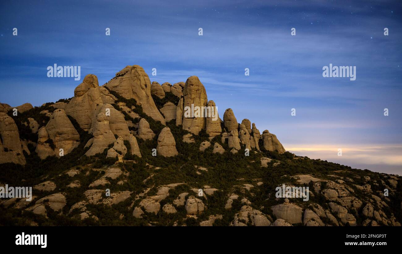 Montserrat mountain at night, seen from the upper station of the Sant Joan funicular (Barcelona, Catalonia, Spain) Stock Photo