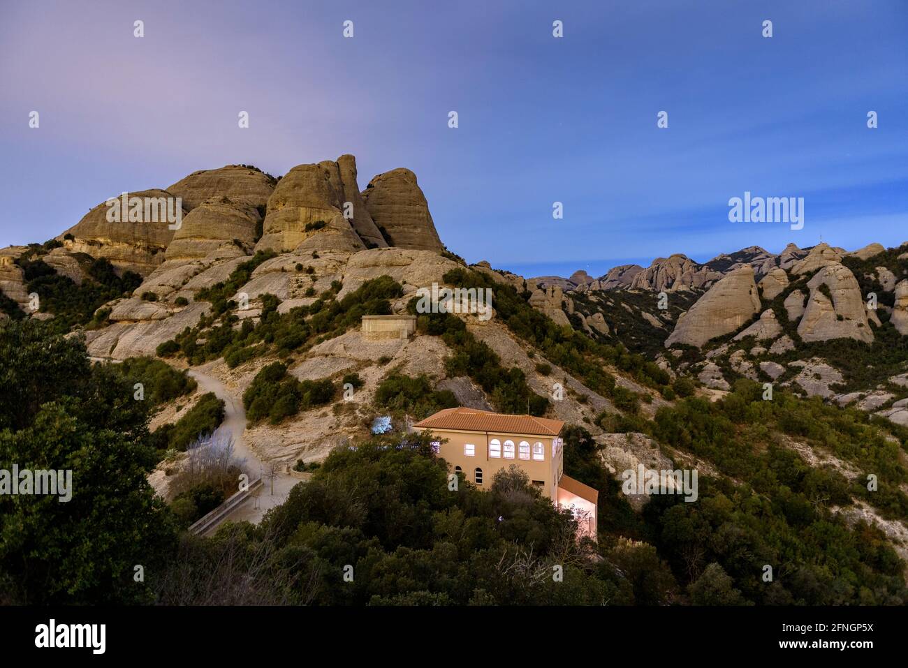 Montserrat mountain at night, seen from the upper station of the Sant Joan funicular (Barcelona, Catalonia, Spain) Stock Photo