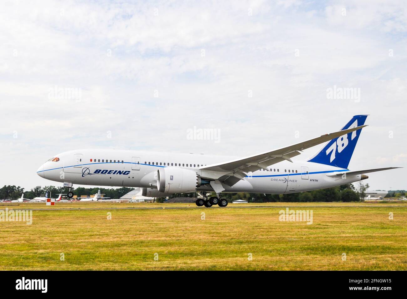 Prototype demonstrator Boeing 787 Dreamliner jet plane in corporate scheme, taking off to fly its debut appearance at the Farnborough Airshow 2010 Stock Photo