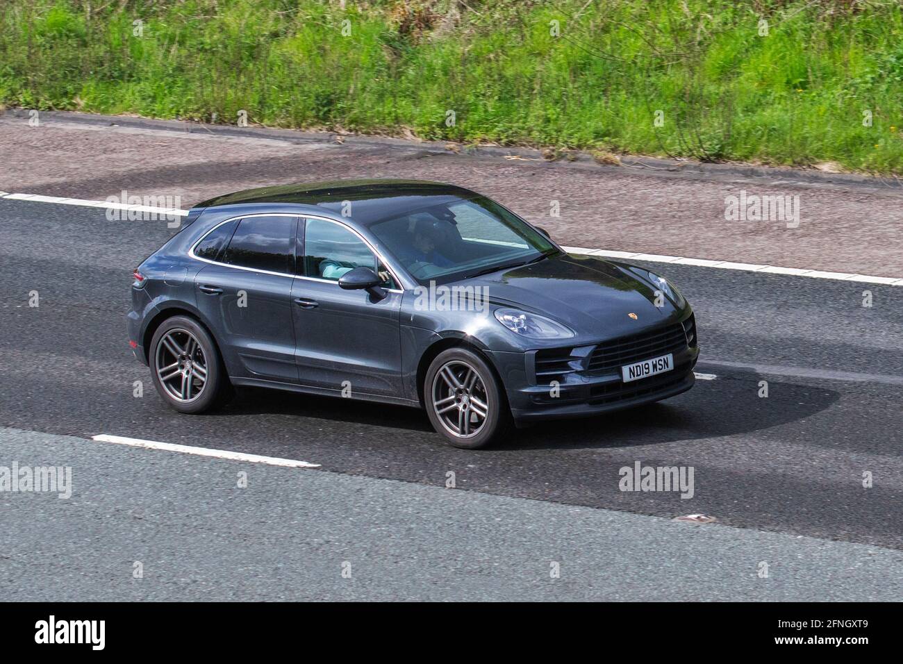 2019 grey Porsche Macan S S-A 2995cc petrol SUV ; Vehicular traffic, moving vehicles, cars, vehicle driving on UK roads, motors, motoring on the M6 motorway highway UK road network. Stock Photo