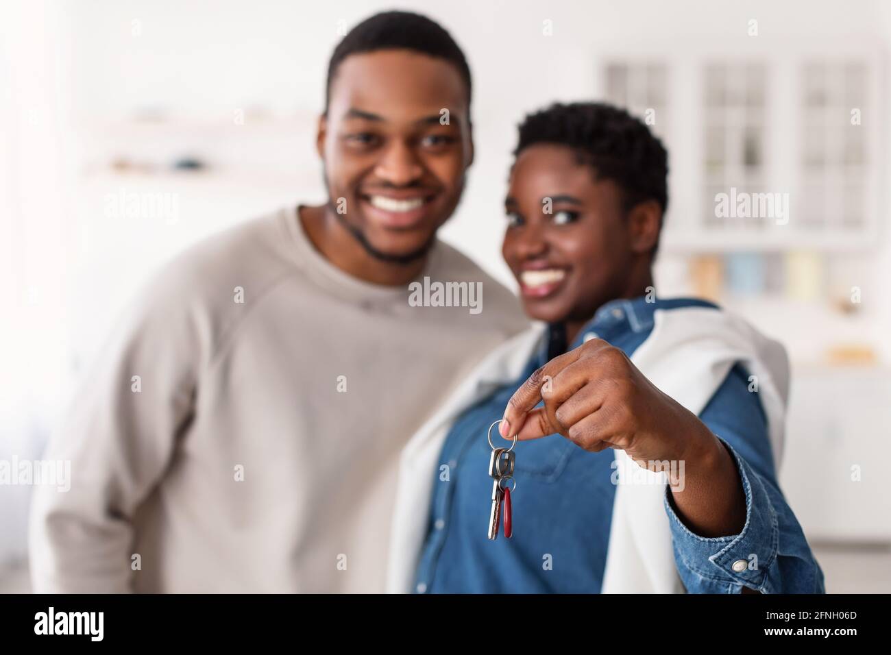 Happy black couple showing keys of their apartment Stock Photo - Alamy