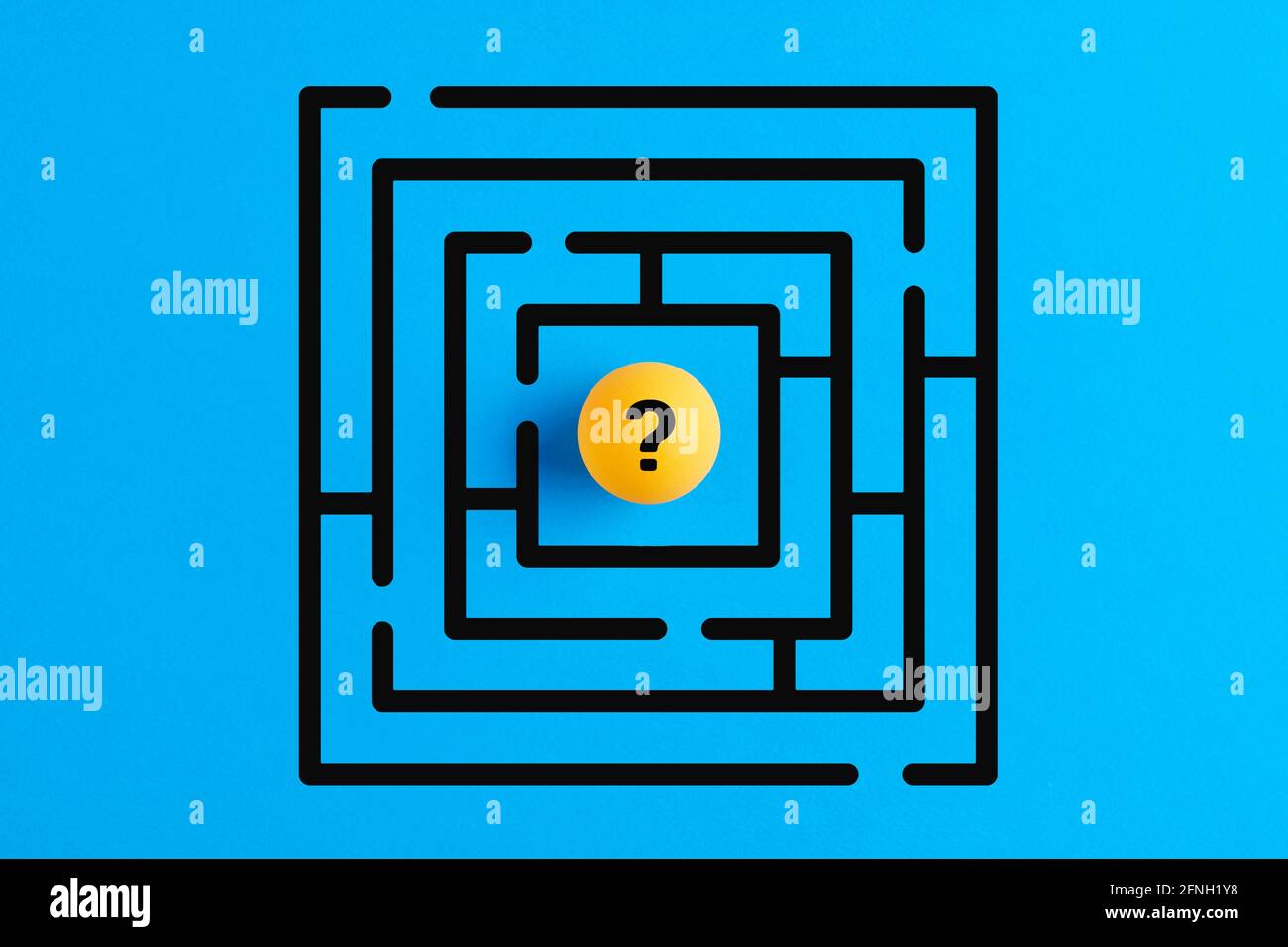Question mark in the middle of a maze or labyrinth. Uncertainty