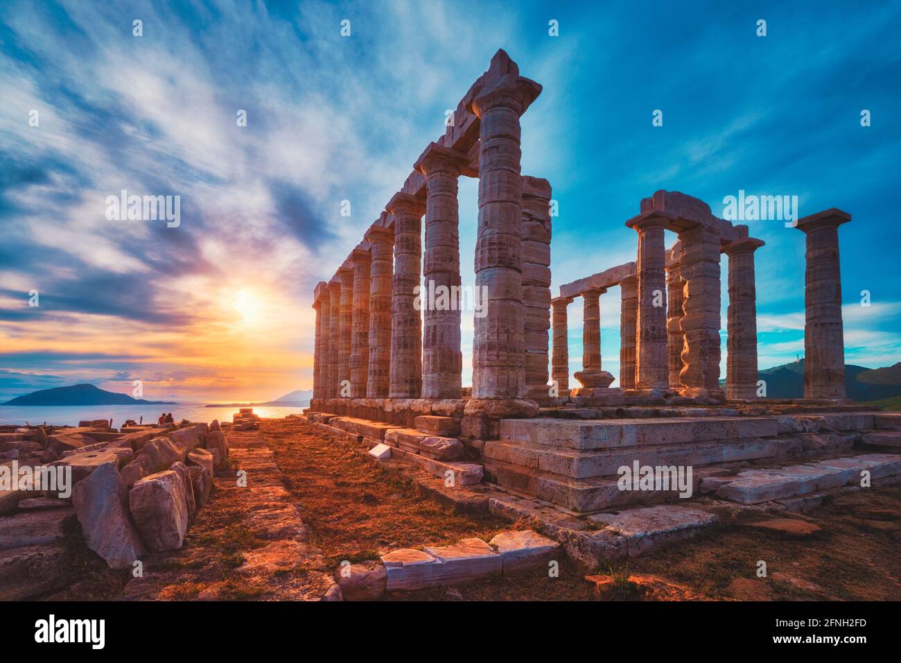 Poseidon temple ruins on Cape Sounio on sunset, Greece Stock Photo