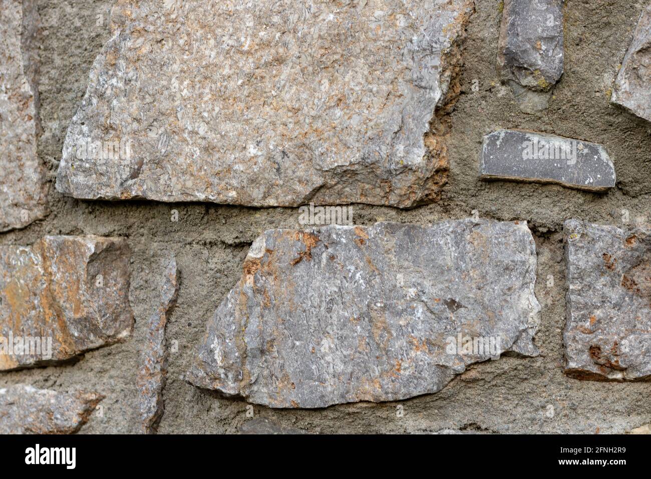 old gray stone wall full frame background Stock Photo - Alamy