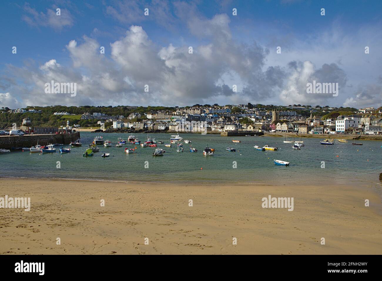 View of St Ives Harbour at high tide on a sunny day Stock Photo