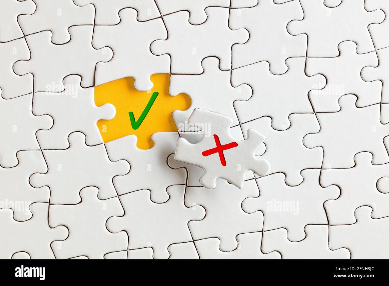 Check mark (right) and cross mark (wrong) on the missing puzzle pieces. To  discover or expose the right or truth concept Stock Photo - Alamy