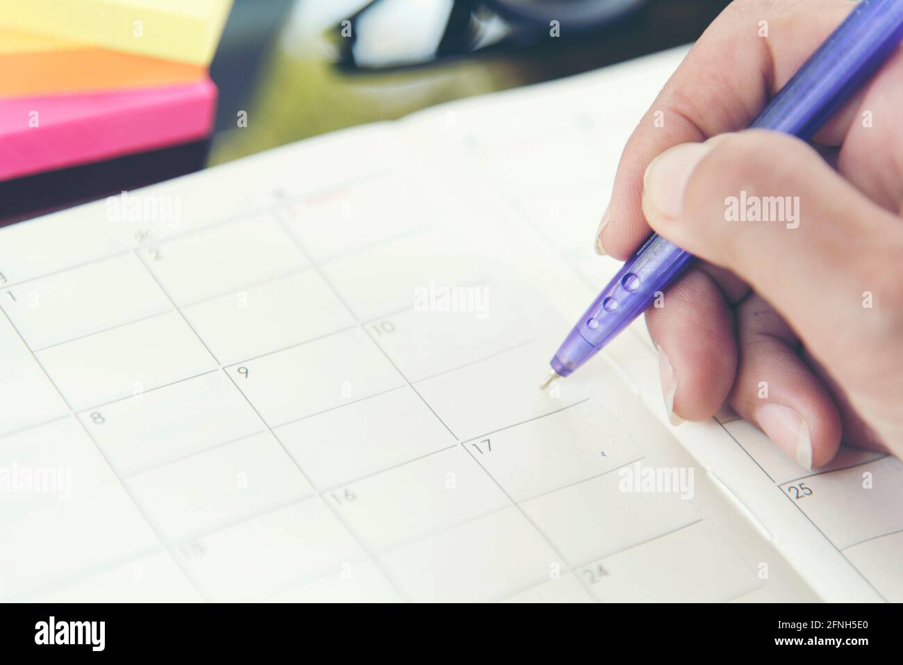 2018 Calendar Event Planner is busy. Businesswoman always Planning Agenda and Schedule using calendar,clock to set timetable organize schedule. Woman Stock Photo