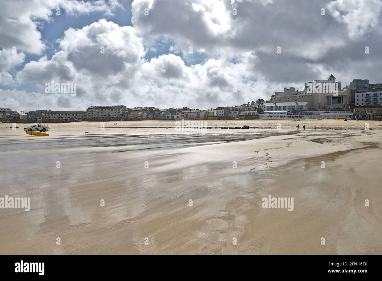 Wet sand at low time on Porthmeor Beach Cornwall Stock Photo