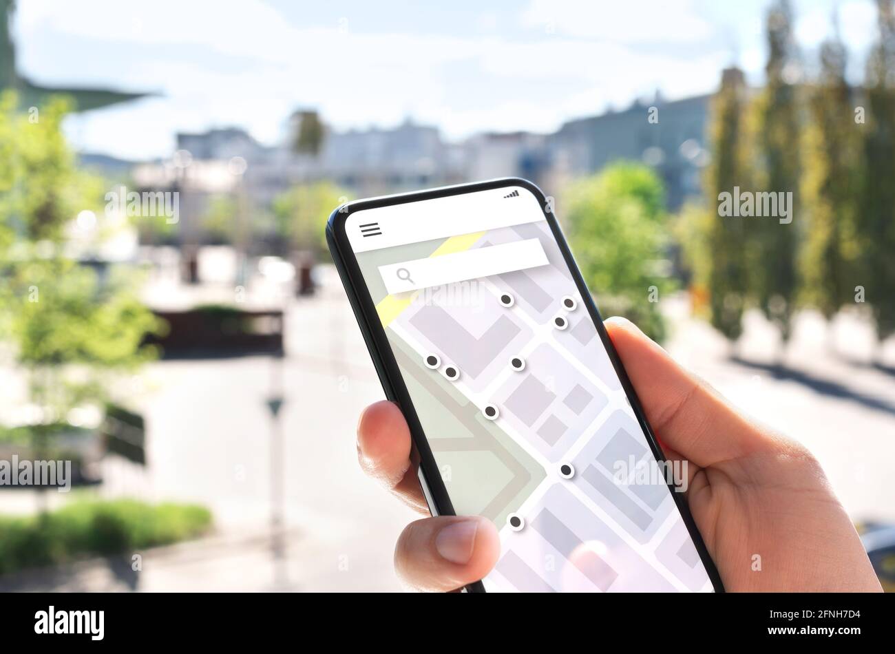 Map app in mobile phone to search location or navigate to destination in city. Place marker and pointer icon. Online GPS guide in smartphone. Stock Photo