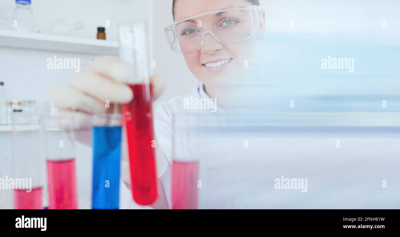 Composition of female scientist in lab holding test tube with motion