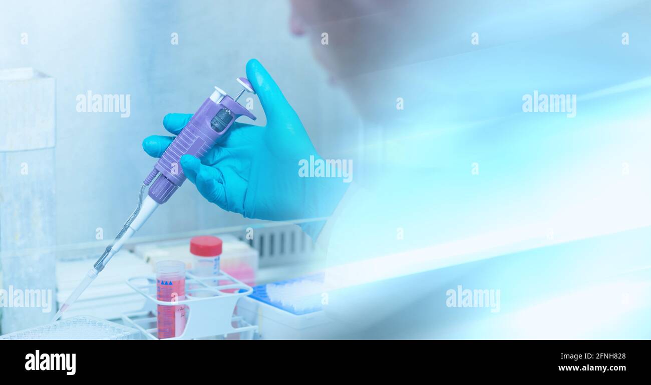Composition of male scientist in lab using pipette with motion blur Stock Photo
