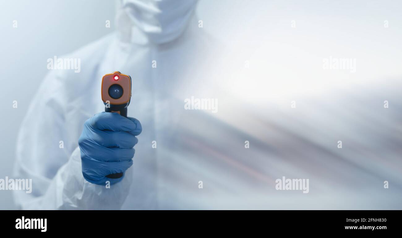 Composition of female scientist in lab using thermometer with motion blur Stock Photo