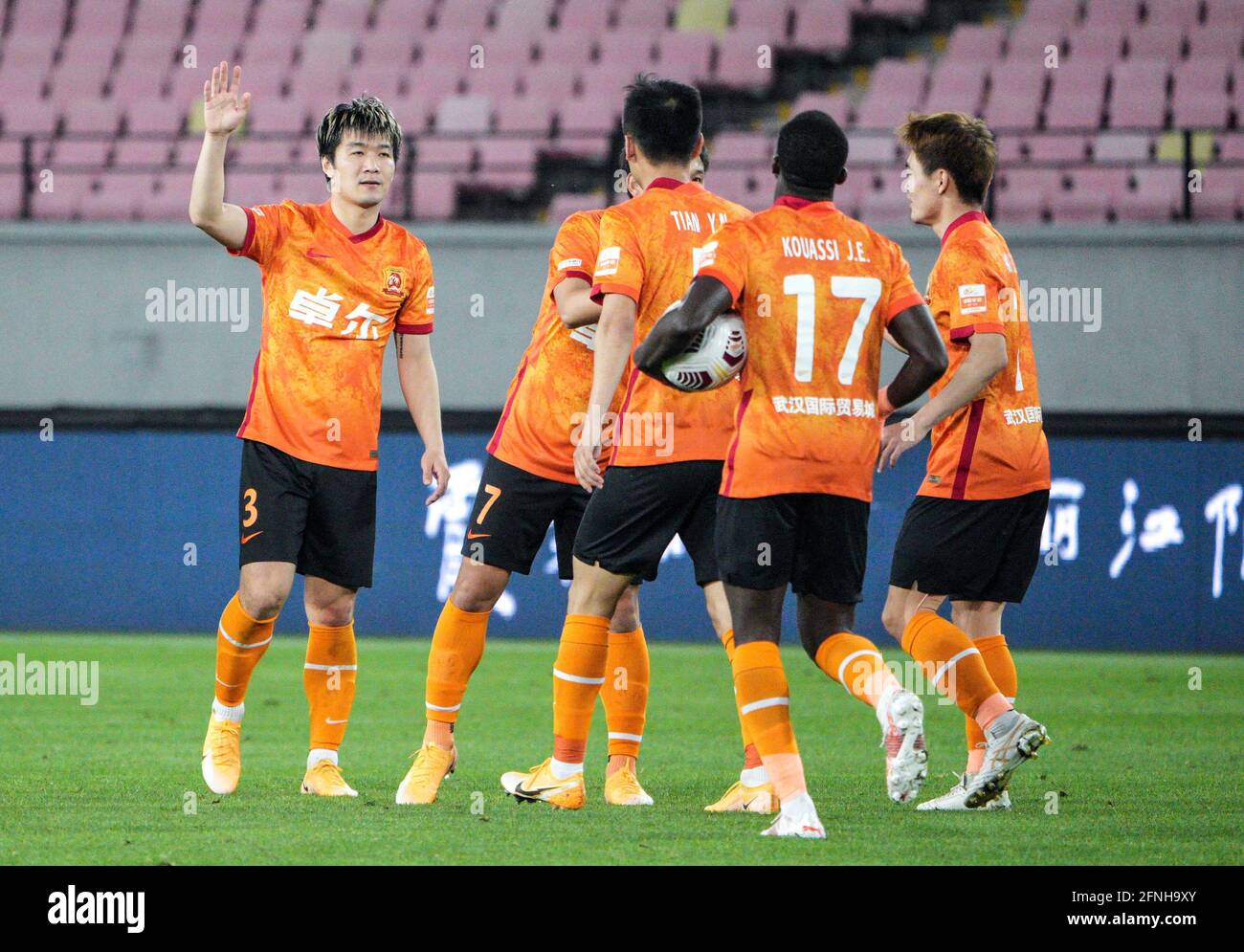 Jiangyin, China's Jiangsu Province. 17th May, 2021. Zhao Honglue (1st L) of Wuhan FC celebrates scoring with teammates during a 2021 season Chinese Football Association Super League (CSL) match against Tianjin JMT FC in Jiangyin, east China's Jiangsu Province, May 17, 2021. Credit: Yang Lei/Xinhua/Alamy Live News Stock Photo