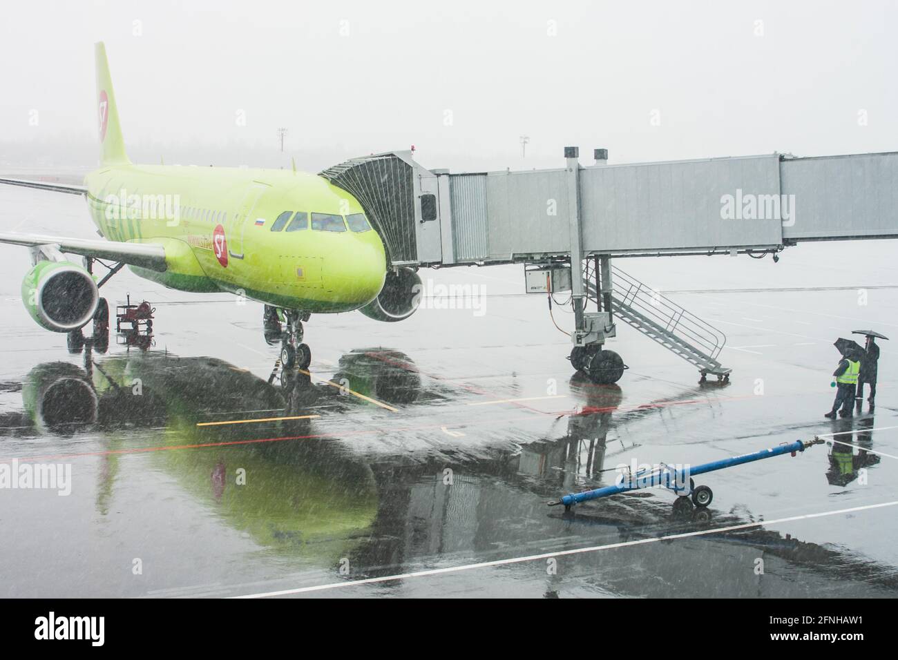 Plane Prepares To Take Passengers To Airport In Difficult Weather