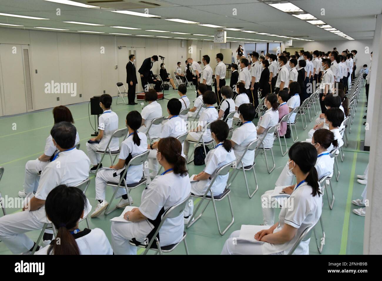 Tokyo, Japan. 17th May, 2021. Japan Self?Defense Forces' officer salute during a launch for large-scale Covid-19 vaccination centres in Tokyo, Japan on Monday, May 17, 2021. This centre will open on May 24, 2021. Tokyo operation units organize Ground, Air and Maritime Self?Defense Forces' (Army, Air force and Navy) 240 officer and private 110 medical worker out of 350 members. Photo by Keizo Mori/UPI Credit: UPI/Alamy Live News Stock Photo