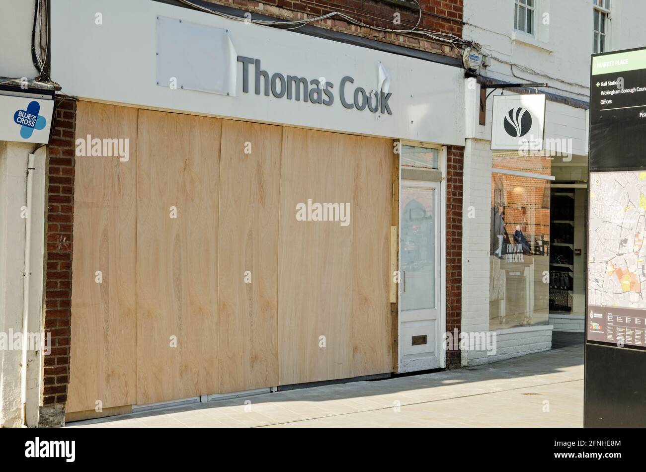 Wokingham, UK - February 28, 2021: A boarded up branch of the defunct travel agency Thomas Cook in Wokingham town centre, Berkshire.  The group ceased Stock Photo