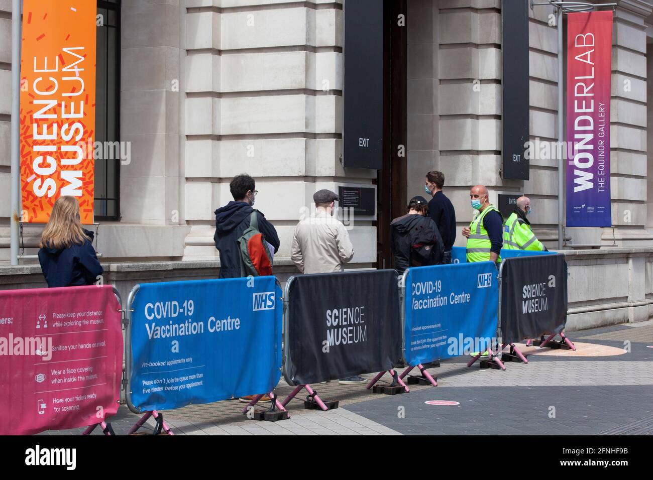 London, UK, 17 May 2021 People queue for their vaccines at an NHS