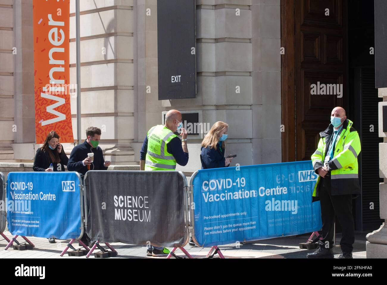 London, UK, 17 May 2021 People queue for their vaccines at an NHS
