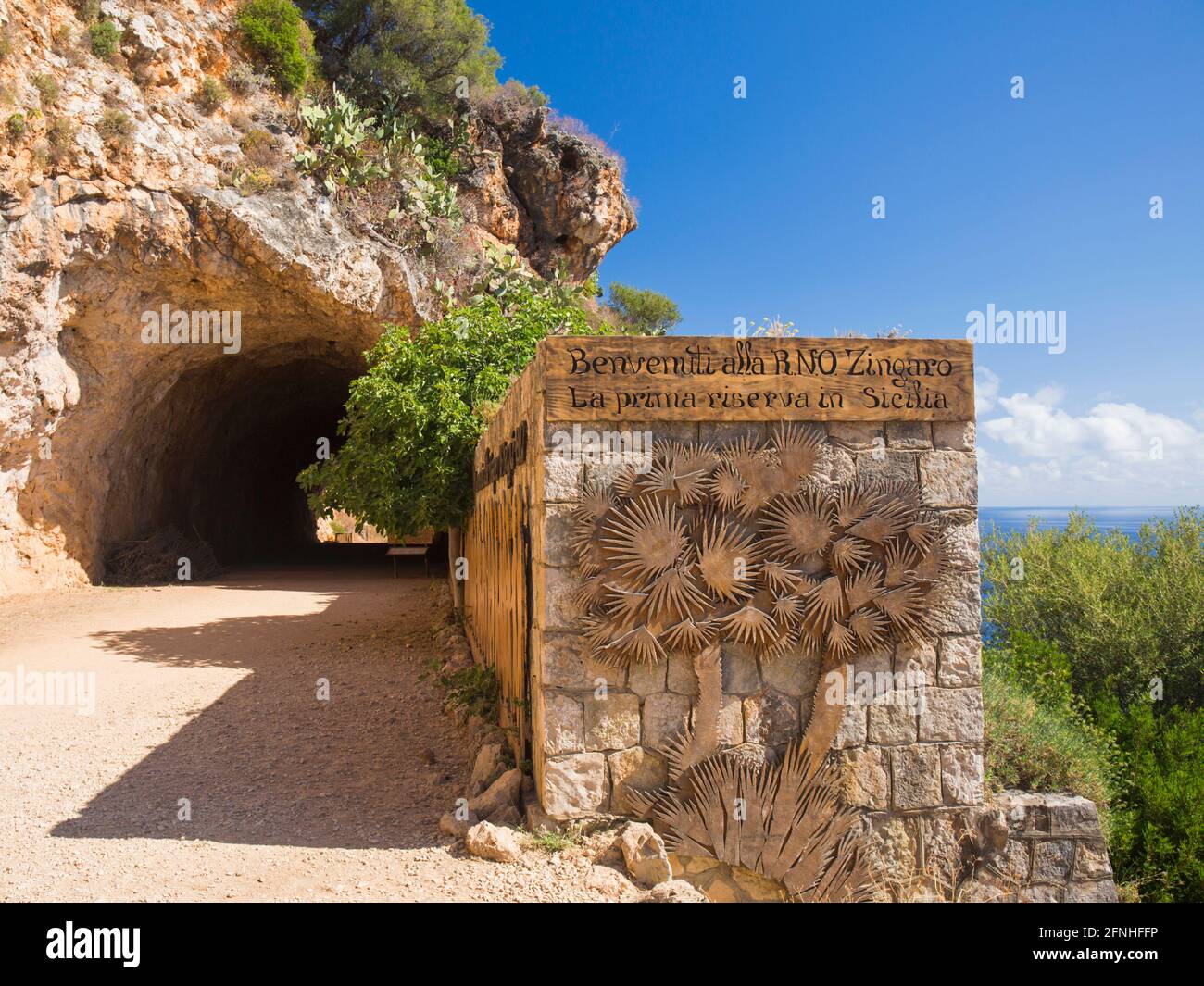 Scopello, Trapani, Sicily, Italy. Eye-catching sign above the Gulf of Castellammare marking southern entrance to the Zingaro Nature Reserve. Stock Photo