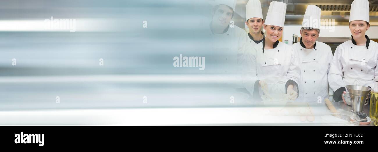 Groups of chefs smiling in a kitchen, restaurant kitchen and food industry concepts Stock Photo
