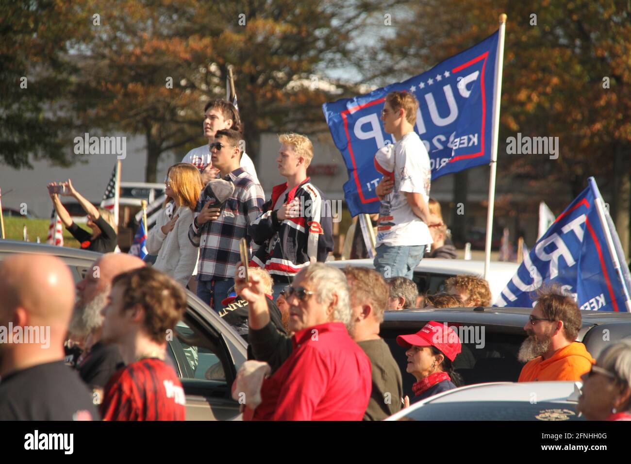November 2020, Virginia, USA. Trump supporters standing for the national anthem during a political event. Stock Photo