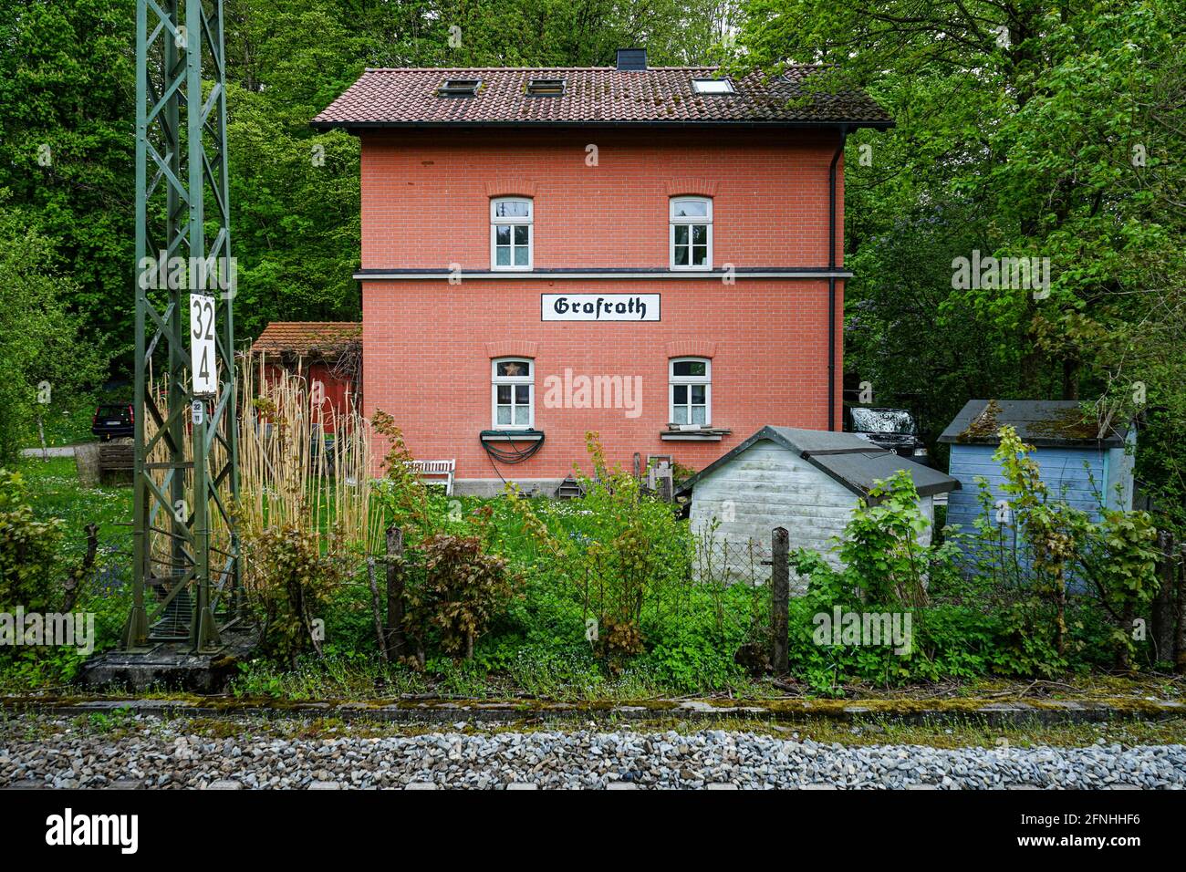 View of the former railroad station in the village of Grafrath in the municipality of Fürstenfeldbruck. Stock Photo