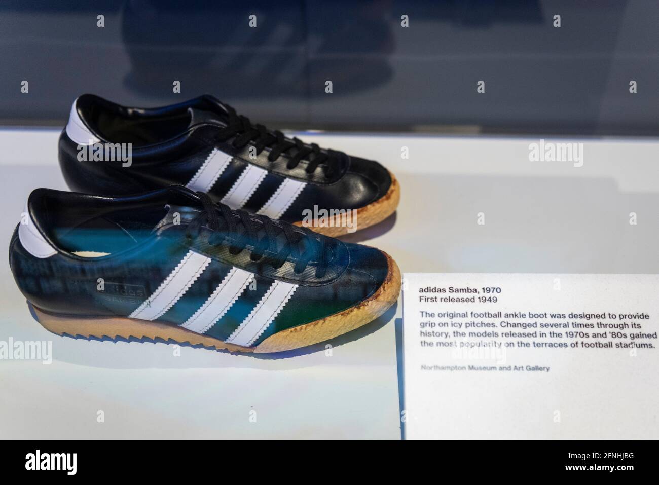 London, UK. 17 May 2021. "Adidas Samba", 1970, first released 1940. The  original football ankle boot was designed to provide grip on icy surfaces.  Preview of “Sneakers Unboxed: Studio to Street” at