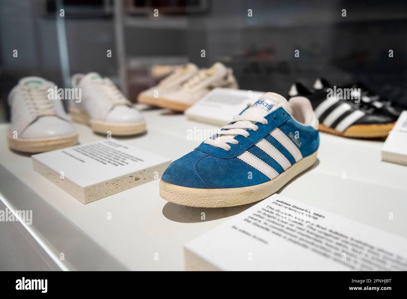 London, UK. 17 May 2021. "Adidas Gazelle", 1991, first released 1966, the  first Adidas training shoe to be made from suede. Preview of “Sneakers  Unboxed: Studio to Street” at the Design Museum